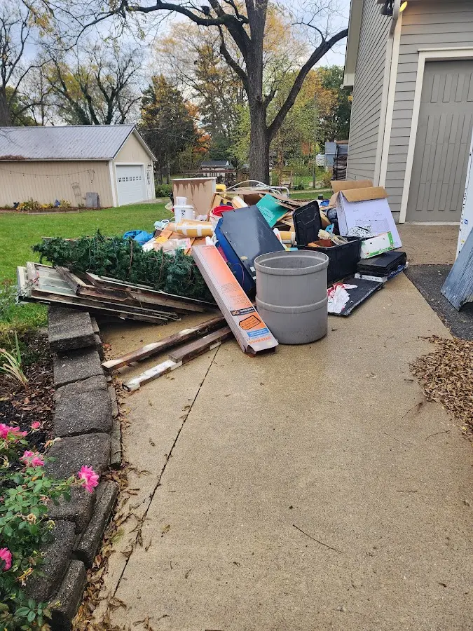 Dumpster being loaded with debris for Estate Cleanout Dumpster Rental in Pawling